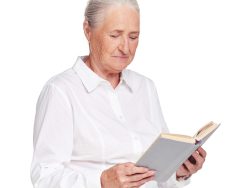 Reading a book Beautiful senior woman reading a book on white background